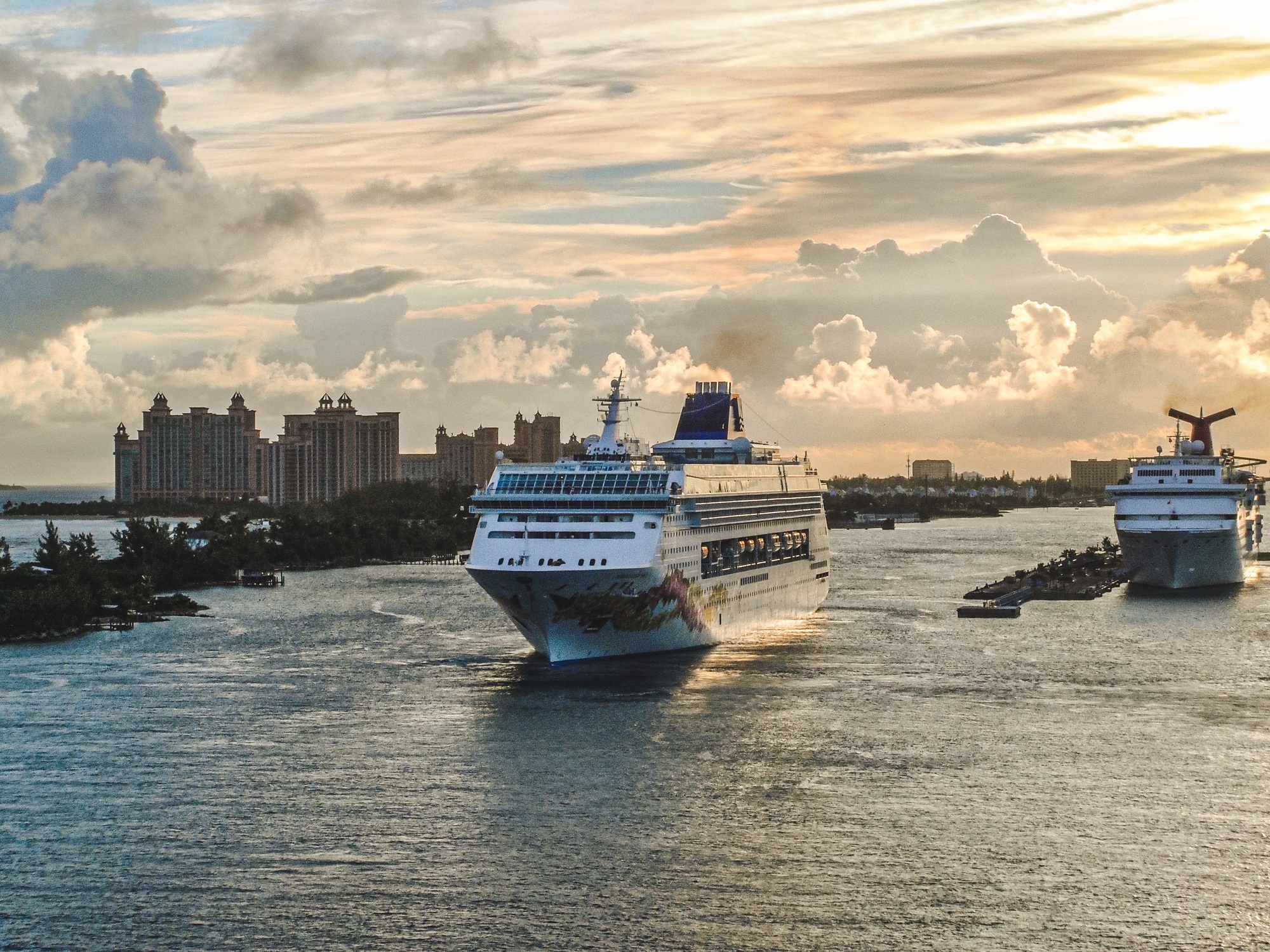 A cruise ship makes its way through the channel coming out of port in Nassau, Bahamas